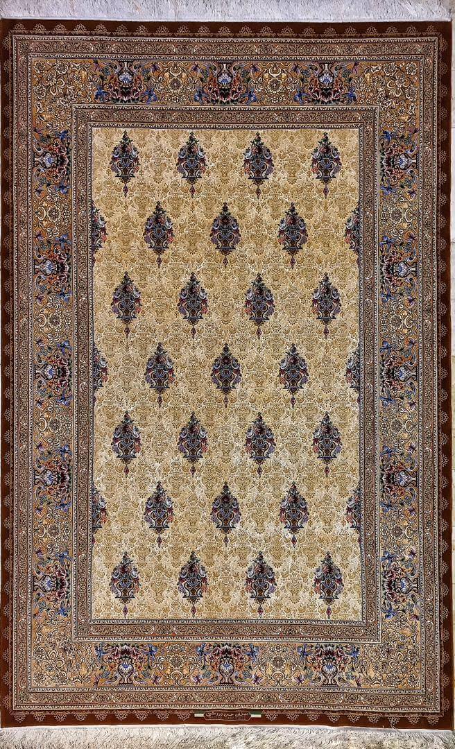 Top view of a rare Persian rug crafted by the late master Hassan Dardashtie, featuring intricate silk and wool patterns in vibrant colors. The rug is a luxurious addition to any room.